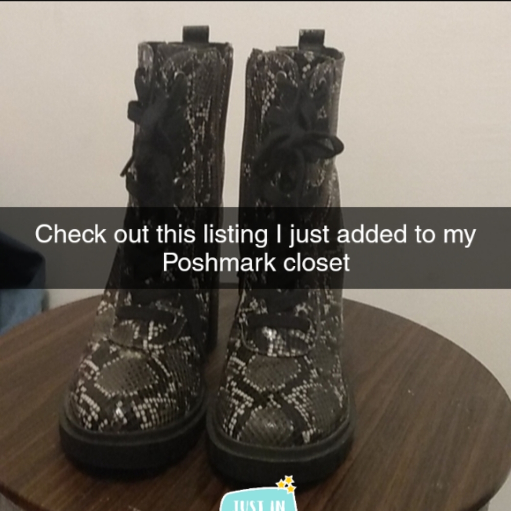 Black boots with a touch of gray& White tie up in front Zips on the side